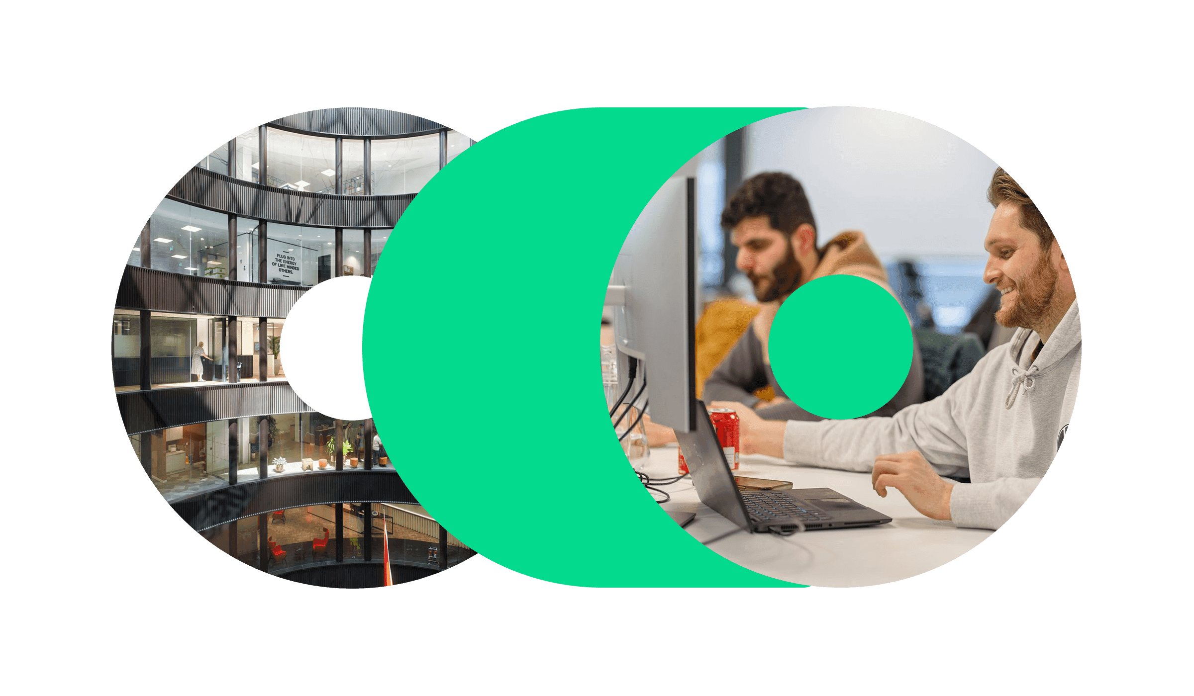 A photo of two men working at their desks